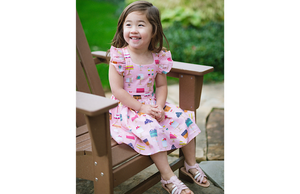 Toddler modeling pink birthday dress