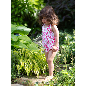 Toddler in baby bubble romper with summery popsicle print