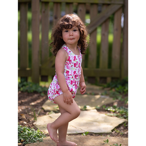 Toddler wearing baby bubble romper in summery popsicle print