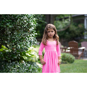 Girl in pink candy stretch velvet twirly dress