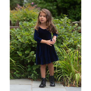 Toddler in girls navy stretch velvet twirly dress