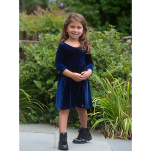 Girl modeling navy stretch velvet twirly dress