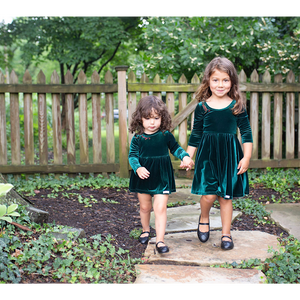 Sister matching christmas outfits in green velvet