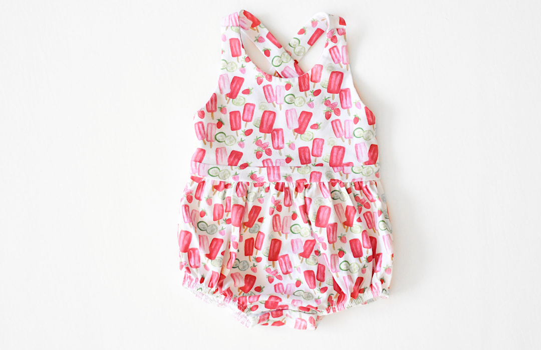 Popsicle romper: Pinafore style bubble romper with cross back straps in popsicle print.  Unique baby clothes!