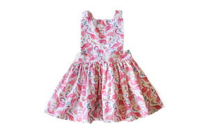 Girls pinafore dress in bright pink flamingo print